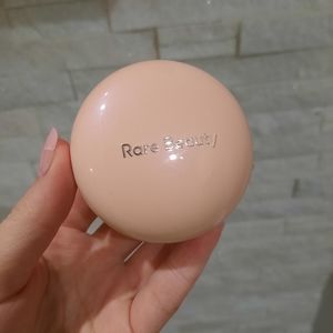 Rare Beauty Highlighter in the shade Exhilarate